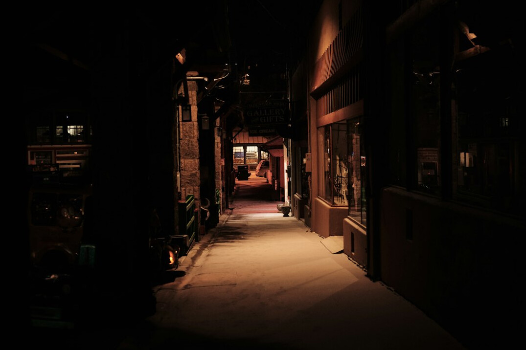 shadowy detective in alley